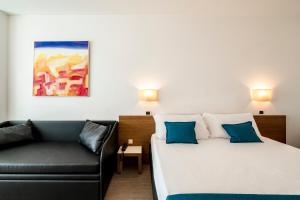 Postel nebo postele na pokoji v ubytování Hotel Cristallo
