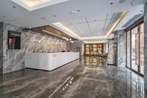 תמונה מהגלריה של Poltton International Apartment - Guangzhou Panyu Government Affairs Center בXuwen