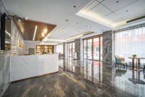 תמונה מהגלריה של Poltton International Apartment - Guangzhou Panyu Government Affairs Center בXuwen