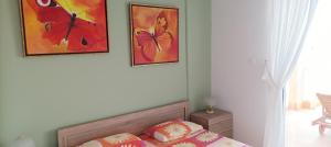 A bed or beds in a room at George & Katerina Houses