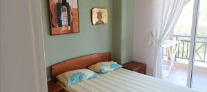 A bed or beds in a room at George & Katerina Houses