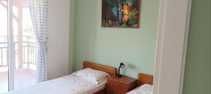 A bed or beds in a room at George & Katerina Houses