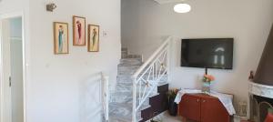 A television and/or entertainment centre at George & Katerina Houses