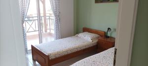 A bed or beds in a room at George & Katerina Houses