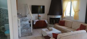A television and/or entertainment centre at George & Katerina Houses