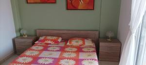 A bed or beds in a room at George & Katerina Houses