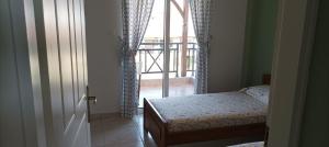 A bed or beds in a room at George & Katerina Houses