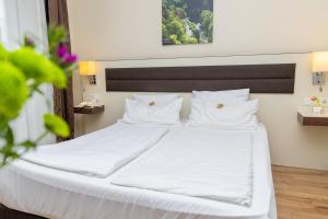 Postel nebo postele na pokoji v ubytování Hotel Nordhausen