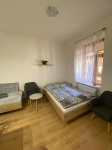 Postel nebo postele na pokoji v ubytování Apartmány Johanka