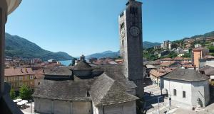 a city with a clock tower and a town at Lago d'Orta attico Sofia in Omegna