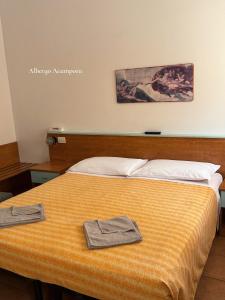 Postel nebo postele na pokoji v ubytování Albergo Acampora