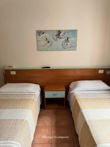 Postel nebo postele na pokoji v ubytování Albergo Acampora