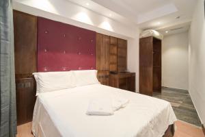 En eller flere senge i et værelse på Menoir Dorsett Madrid Usera + 17 billeder