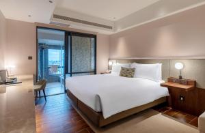 Ένα ή περισσότερα κρεβάτια σε δωμάτιο στο Kilin Hotel, JiaoXi