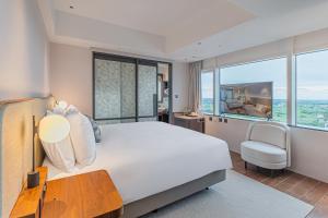 Ένα ή περισσότερα κρεβάτια σε δωμάτιο στο Kilin Hotel, JiaoXi