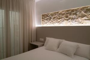 Un pat sau paturi într-o cameră la www TopCapCana Com Costa Brava L'Escala