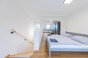 Un pat sau paturi într-o cameră la Rezidence Novosadská