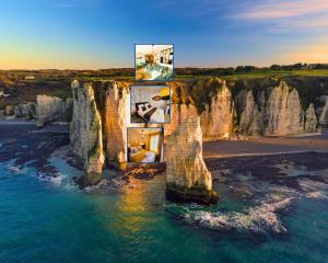 an unusual house on a cliff near the water at Giulia House Fécamp - Seaside Escape, Modern & Cozy in Fécamp