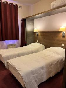 Ένα ή περισσότερα κρεβάτια σε δωμάτιο στο Superbe appartement ski aux pieds