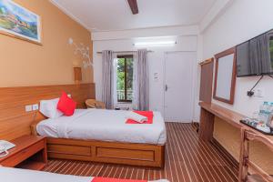 Letto o letti in una camera di Basundhara Resort Pokhara
