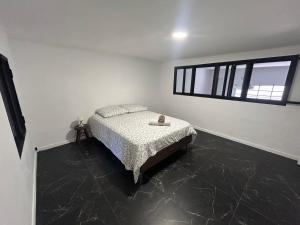 a bedroom with a bed and a window at Liberte 2 in Marseille