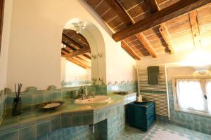 a bathroom with a sink and a mirror at Villa Messori Spa in Castelvetro di Modena +55 photos