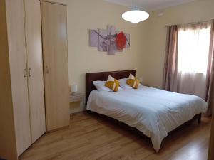 A bed or beds in a room at Serene Haven Apartment with Three spacious bedrooms