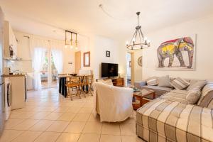 a living room with a couch and a table at Casa Mameli Αpartments in Kallithea Halkidikis