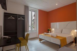 Postel nebo postele na pokoji v ubytování RRRapido Hotel