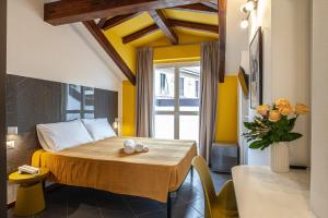 Postel nebo postele na pokoji v ubytování RRRapido Hotel