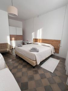 a bedroom with a large bed in a room at Civico 9 in Bonorva +76 photos