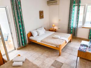 Llit o llits en una habitació de Amisos Apartmani