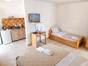 Llit o llits en una habitació de Amisos Apartmani