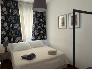 a bedroom with a bed with two towels on it at Taormina Casa Liliana in Taormina