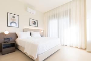 Letto o letti in una camera di Palm View Suites