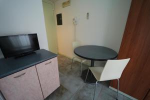 TV a/nebo společenská místnost v ubytování Lugano Residence