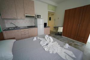 Postel nebo postele na pokoji v ubytování Lugano Residence
