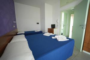 Postel nebo postele na pokoji v ubytování Lugano Residence