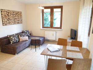 Posezení v ubytování PRESTIGE PARK apartament z tarasem i parkingiem