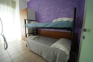 Postel nebo postele na pokoji v ubytování Lugano Residence