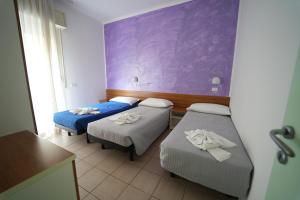 Postel nebo postele na pokoji v ubytování Lugano Residence