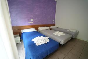 Postel nebo postele na pokoji v ubytování Lugano Residence