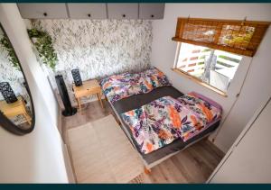 an overhead view of a small bedroom in a tiny house at Domek na Roztoczu - Jacuzzi in Krasnobród