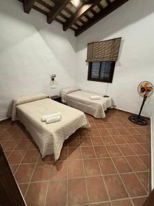 Postel nebo postele na pokoji v ubytování Villa Los abuelos