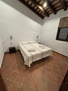 Postel nebo postele na pokoji v ubytování Villa Los abuelos