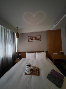 Ένα ή περισσότερα κρεβάτια σε δωμάτιο στο Tenlien onsen Hot Spring Hotel
