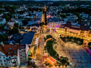 an overhead view of a city at night at SeaSide Sopot - butikowe noclegi przy plaży in Sopot