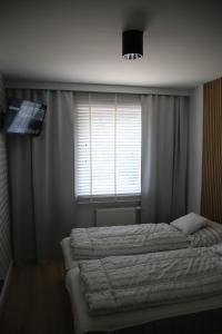Postel nebo postele na pokoji v ubytování Apartament ARS Platinium Wisła-Spokojna