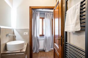 Ένα μπάνιο στο Pisana 236 Suites