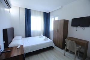 Postel nebo postele na pokoji v ubytování BALŞEN HOTEL